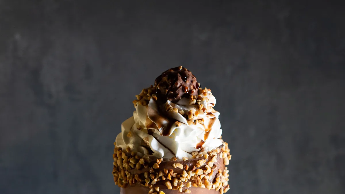 Chocolate milkshake topped with whipped cream — the highest-calorie add-on at Dave's Hot Chicken