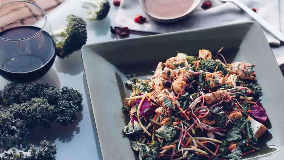 A bowl of creamy homemade kale slaw — copycat Dave's Hot Chicken kale slaw recipe