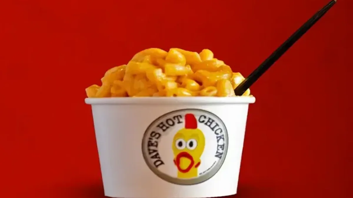 A cup of Dave's Hot Chicken mac and cheese — the best side on the menu