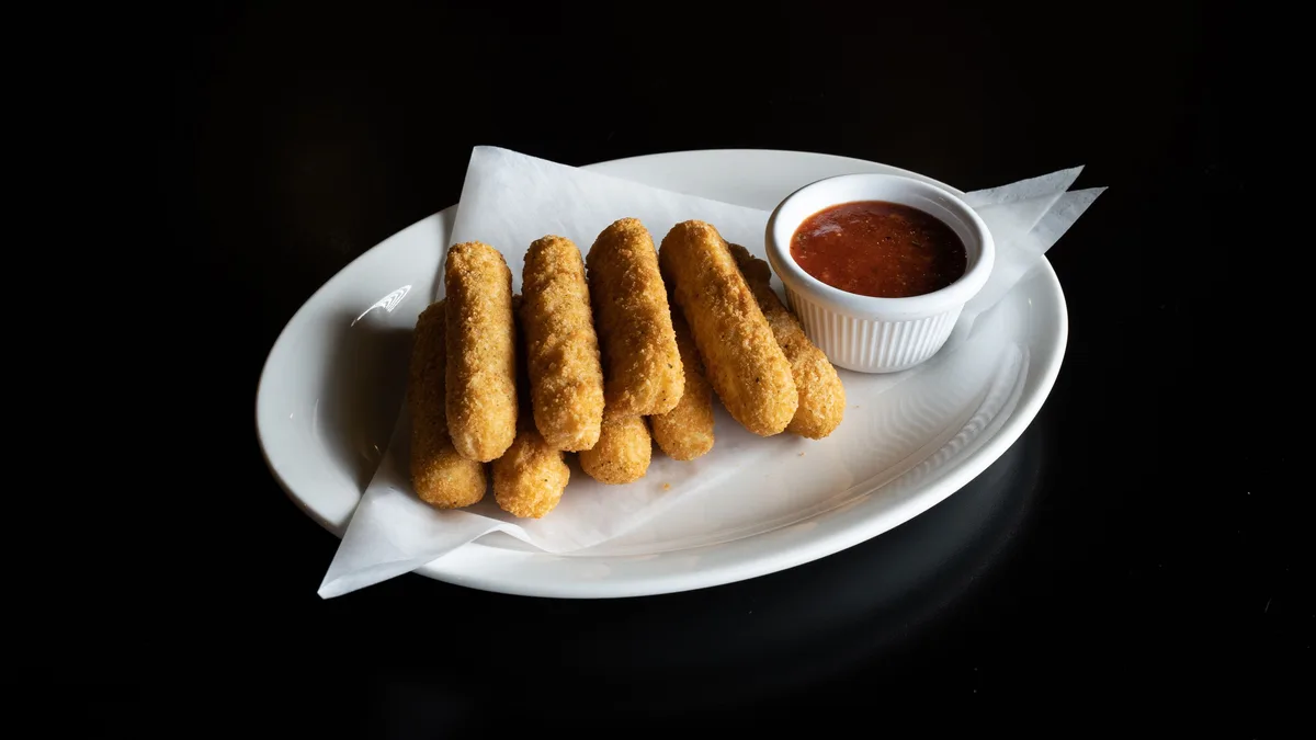 Golden fried mozzarella sticks with marinara — the vegetarian Hot Mozz option at Dave's Hot Chicken