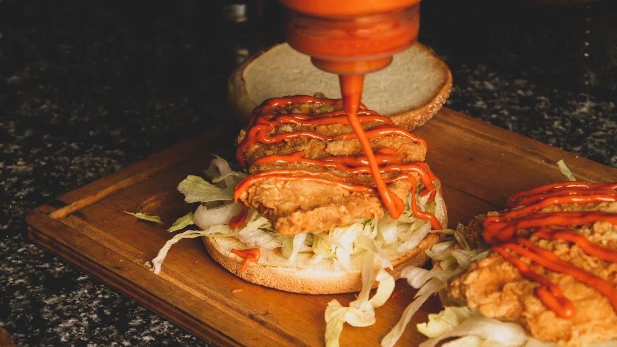 A spicy fried chicken sandwich — deciding between Dave's Hot Chicken and Raising Cane's