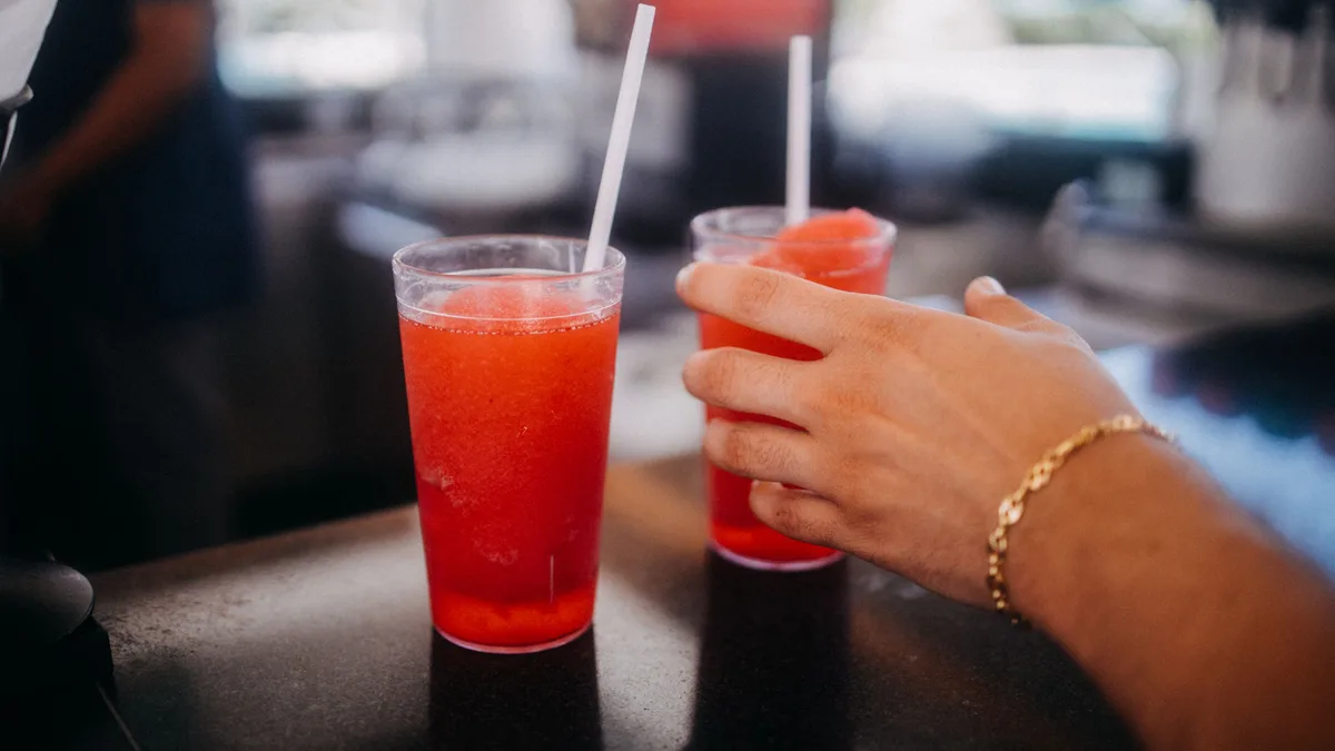 Two frozen red slushie drinks on a counter — the best way to cool the heat at Dave's Hot Chicken