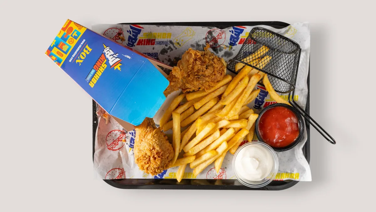 A generous fast-food meal of fried chicken, fries, and sauces — is Dave's Hot Chicken worth the price